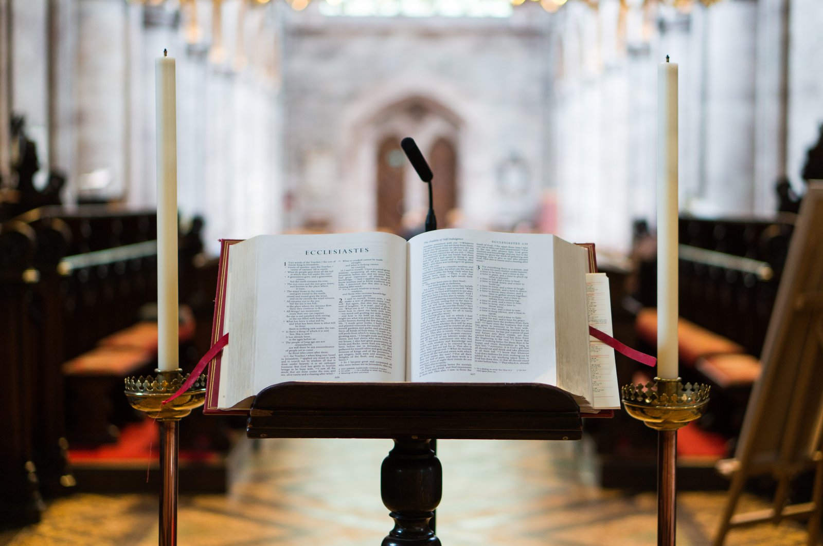 Bible displayed on podium inside a church