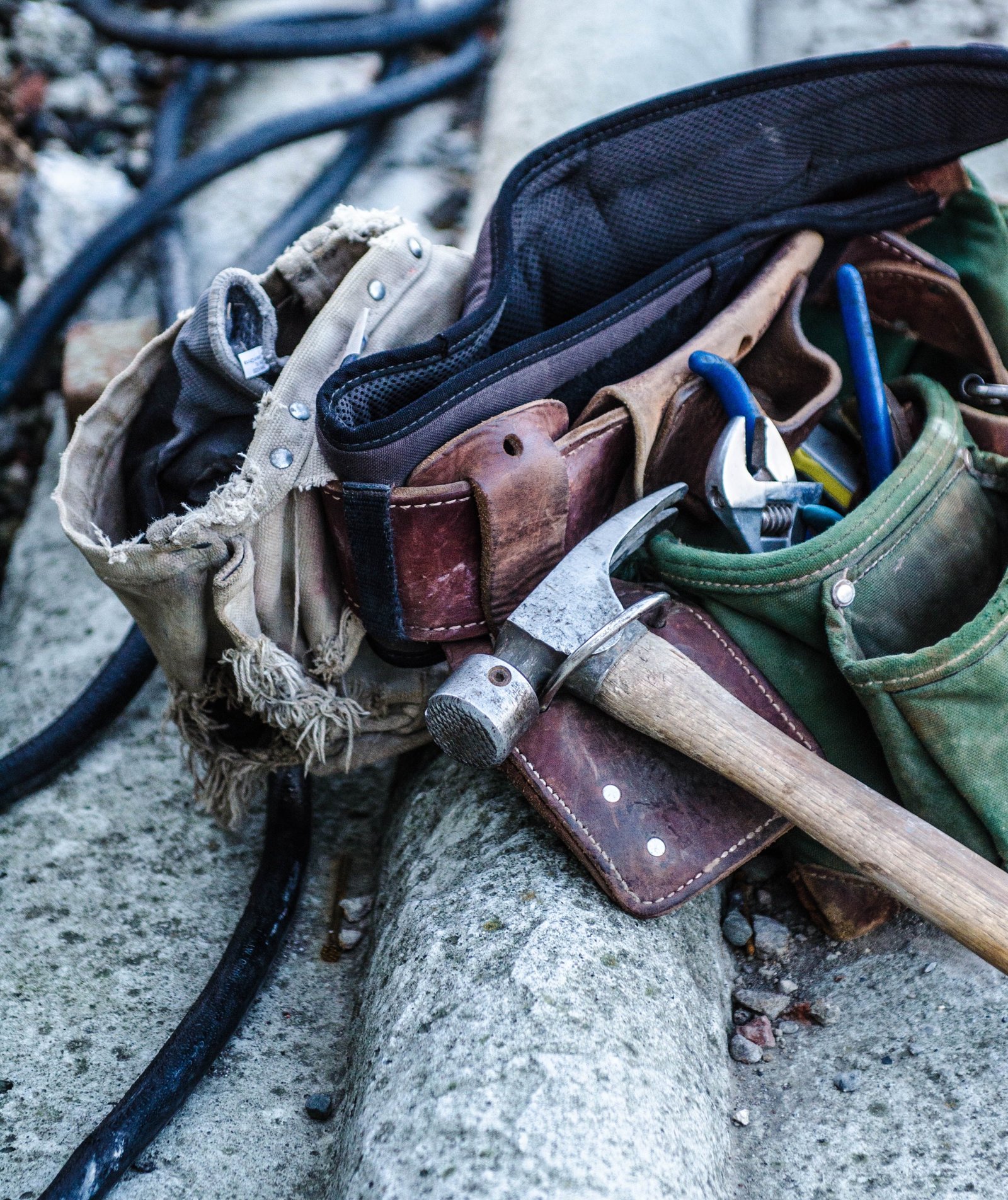 Worn tool belt filled with various tools